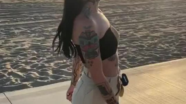 Flashing her tits on the beach 