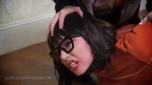 Velma From Scooby Doo Cosplayer tied up on the floor